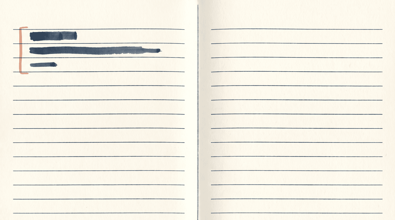 An open ruled notebook from above, 3 short ink marks near the top of the left page, the rest empty.